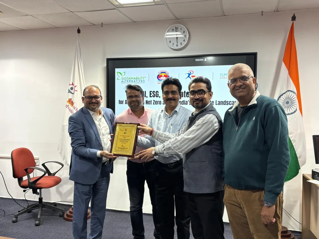 Participants presenting a plaque beside the AI, ESG and Climate Action event screen.