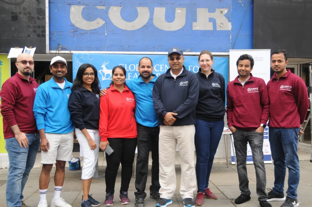 The outreach team posing together beside the clean air display.