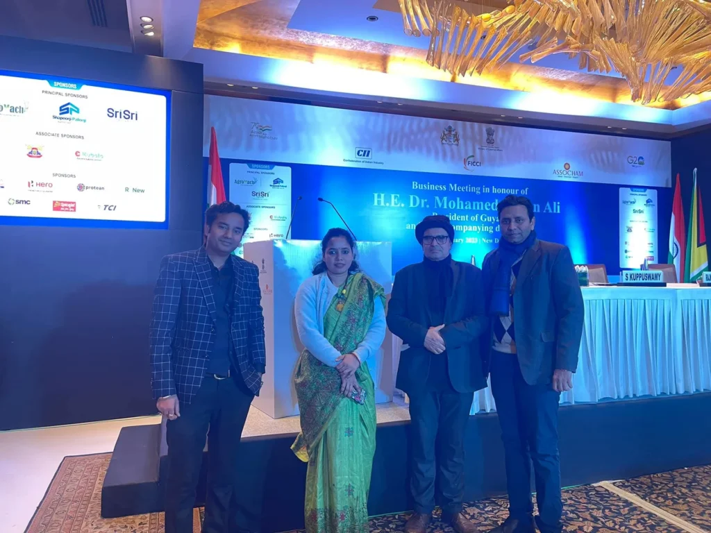 Participants in front of the India-Guyana business meeting stage.