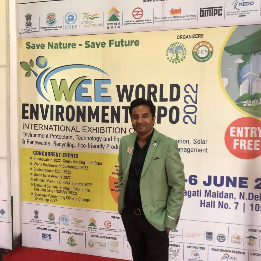 An attendee beside the World Environment Expo 2022 display.