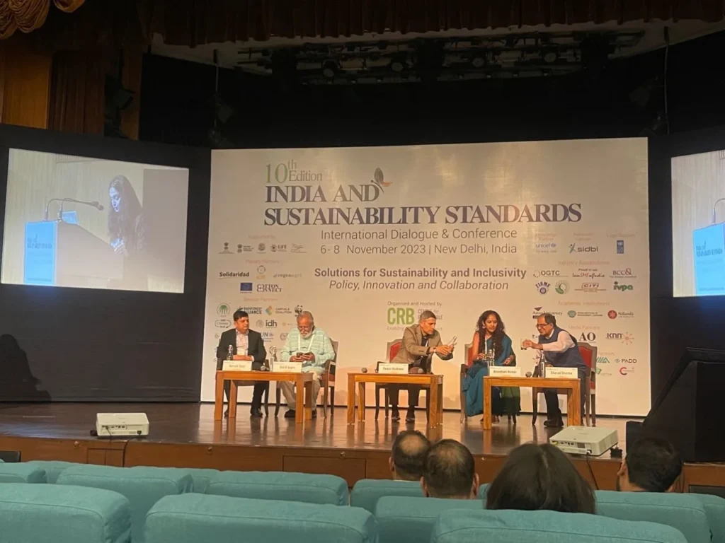A panel discussion beneath the India and Sustainability Standards 2023 banner.