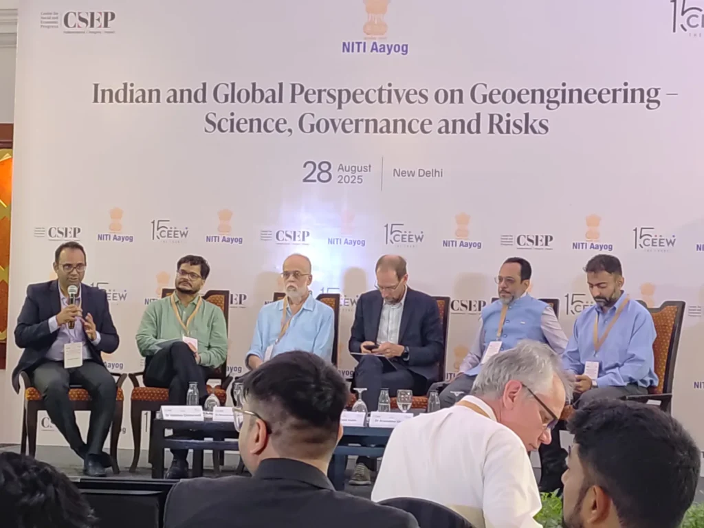 A speaker and panel members during the geoengineering workshop.