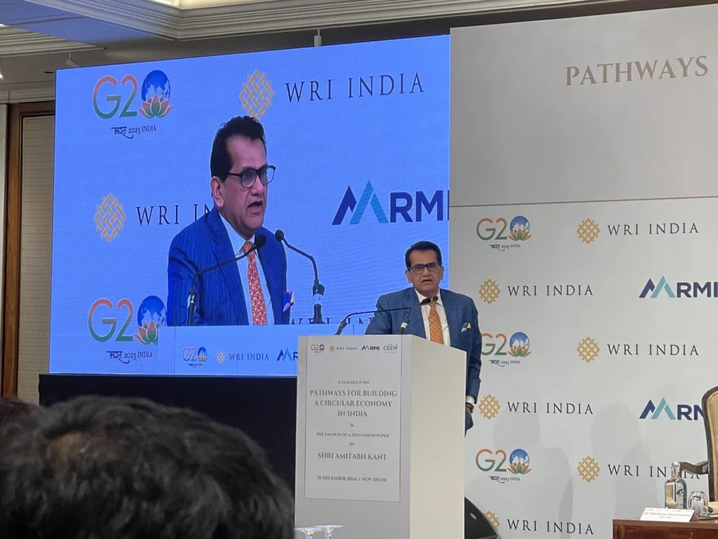 A speaker addressing the audience from the circular economy event lectern.