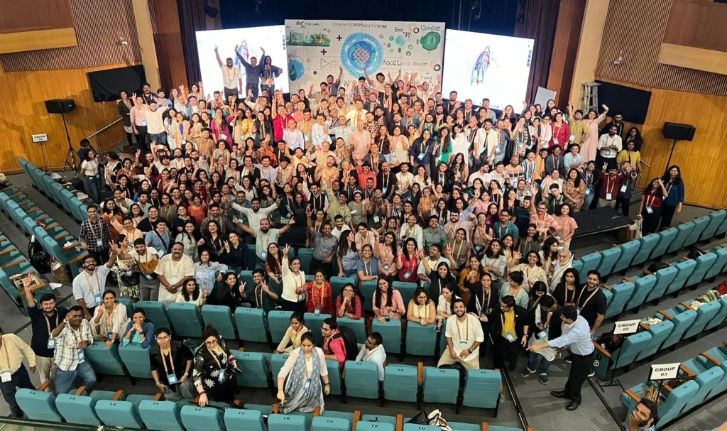 A large group photograph in the conference auditorium.