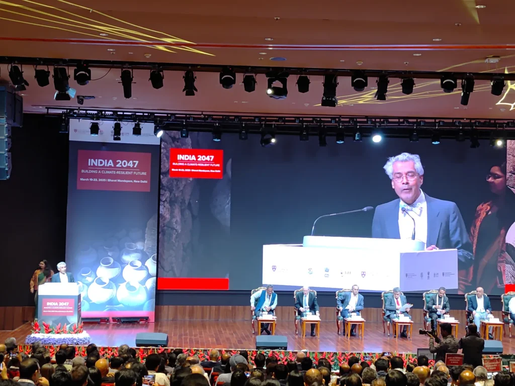 A speaker shown on the main screen above the conference panel.